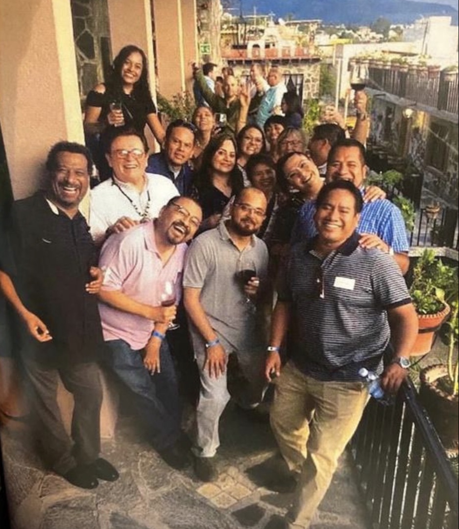 Dr. Haywood Hall with the PACE MD team and colleagues on a balcony in San Miguel de Allende at sunset